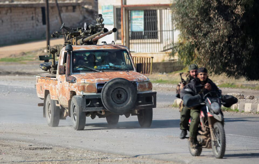 As Syrian rebels sweep into Aleppo, army closes airport and roads, sources say