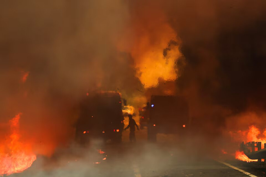 Three firefighters die as Portugal battles dozens of wildfires