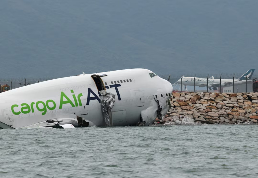 Cargo plane slides off runway in Hong Kong, killing two airport staff